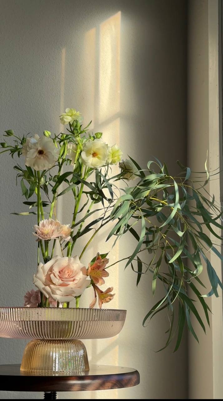 Ikebana arrangement in coupe bowl