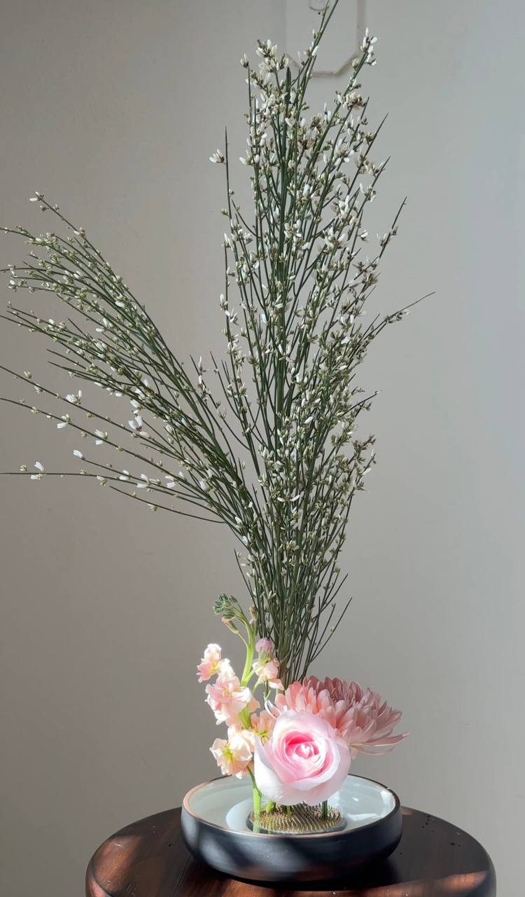 Ikebana arrangement with tall branches