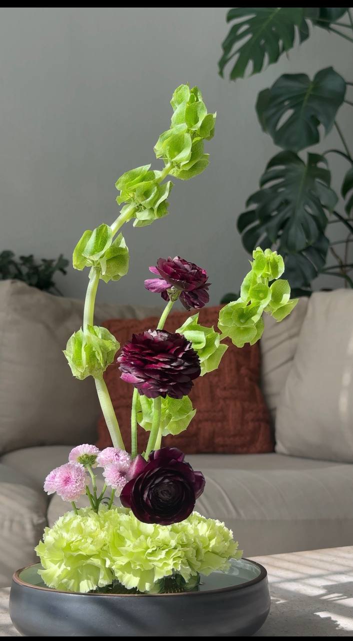 Bells of Ireland with sculptural ranunculus